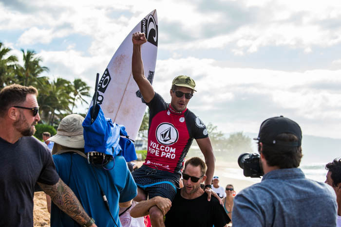 Finals Day at the 2017 Volcom Pipe Pro was unpredictable! We kicked off the morning early with the two remaining heats of Round 3, then we immediately got into Round 4 competition. Waves started off slow as the sun rose over Sunset Elementary, but it wasn’t long before sets started rolling in and guys started dropping some big scores.

[caption id="attachment_7088" align="alignnone" width="700"]<img class="size-full wp-image-7088" src="https://www.easternsurf.com/wp-content/uploads/2017/02/Finals-Day-Volcom-Pipe-Pro-Hawaii-Feb-9-photo-Lugo-015.jpg" alt="" width="700" height="525" /> <em>Volcom, still True To This after all these years. Photo: Lugo/Volcom</em>[/caption]

The first 9-point ride went to Brazil’s Adriano De Souza on a heavy Backdoor wave in his first heat of the competition to secure himself into Round 4. Along with Adriano, Ian Crane, Benji Brand, and Luke Shepardson advanced to the next round.

[caption id="attachment_7084" align="alignnone" width="700"]<img class="size-full wp-image-7084" src="https://www.easternsurf.com/wp-content/uploads/2017/02/Adriano-Finals-Day-Volcom-Pipe-Pro-Hawaii-Feb-9-photo-Random-01.jpg" alt="" width="700" height="467" /> <em>Adriano de Souza. Photo: Volcom</em>[/caption]

Round 4 saw similar off-beat scores from the inconsistent, yet improving sets, but boys made it happen. Brian Toth kicked off Heat 2 with a solid 6-point ride, while in the last minute of the heat, Kiron Jabour dropped to third place after Soli Bailey secured solid 6.13 score.

[caption id="attachment_7082" align="alignnone" width="700"]<img class="size-full wp-image-7082" src="https://www.easternsurf.com/wp-content/uploads/2017/02/Brian-Toth-Bielmann-Finals-Day-Volcom-Pipe-Pro-Hawaii-Feb-9-photo-Brian-Bielmann-017.jpg" alt="" width="700" height="467" /> <em>Puerto Rico’s Brian Toth charged on his way to the Quarterfinals. Photo: Brian Bielmann/Volcom</em>[/caption]

Heat 3 we saw <a href="https://www.instagram.com/p/BQTchM_F1VF/?taken-by=volcom">Mitch Coleborn bag a solid Pipe wave</a> earning himself a 6.17 to push himself into the lead, and right behind him, Koa Smith took off on a similar Pipe wave, although not as deep as Coleborn, and earned himself a 5-point ride. <a href="https://www.instagram.com/p/BQTeA1xAEOp/?taken-by=volcomsurf">John John Florence once again delivered</a>, dropping a 7.5 score right off the bat, then following it up with a 5.17 and 6.83 to hold the heat.

[caption id="attachment_7087" align="alignnone" width="700"]<img class="size-full wp-image-7087" src="https://www.easternsurf.com/wp-content/uploads/2017/02/John-John-Finals-Day-Volcom-Pipe-Pro-Hawaii-Feb-9-photo-Random-08.jpg" alt="" width="700" height="467" /> <em>John John Florence. Photo: Volcom</em>[/caption]

Also getting through Heat 4 was Hawaii’s Hank Gaskell. Heat 5 saw Brazil’s David do Carmo pull off a rocky bottom turn on a Pipe wave and miraculously got spit out with his hands in his air to earn a well-deserved 6.83, while crowd-favorite Mason Ho surprisingly went down due to lack of waves in the heat. The next heat saw more upsets with Makuakai Rothman being knocked out, as well as Yago Dora, who has been in-form the whole event. But it was <a href="https://www.instagram.com/p/BQTn9dZgcjW/?taken-by=volcomsurf">Bruce Irons</a>, Aritz Aranburu, Lucas Silveira, Luke Shepardson, Adriano De Souza, and Makai McNamara who all coupled good enough scores to move into the Quarterfinals.

[caption id="attachment_7080" align="alignnone" width="700"]<img class="size-full wp-image-7080" src="https://www.easternsurf.com/wp-content/uploads/2017/02/Yago-Dora-Finals-Day-Volcom-Pipe-Pro-Hawaii-Feb-9-photo-Random-07.jpg" alt="" width="700" height="467" /> <em>Yago Dora. Photo: Volcom</em>[/caption]

During the Quarterfinals, the side wind had slightly picked up and turned things a bit messier in the lineup, but there were still some gems to be had. Soli Bailey nabbed a 6.17 on a clean Backdoor right, to add to his previous 4.0, and an on-fire Leandro Usuna from Argentina grabbed a couple mid-range scores, both enough to advance them into the Semifinals. Heat 2 saw slower wave conditions and increased wind as John John Florence, Griffin Colapinto, Mitch Coleborn, and Brian Toth tried battling through the conditions in any way possible. While they were hoping for barrels, it turned out to be turns that prevailed as John John and Griffin each found a Backdoor wave which delivered their advancement. Quarterfinal Heat 3 went nearly 15 minutes before anyone had caught a decent wave, and it was Bruce Irons who delivered the first punch on a smaller Backdoor barrel to receive a well-earned 6.33 score. Along with Bruce, it was David do Carmo to roll into the already-stacked Semifinal heats. Heat 4 was another one for turns, with a sneaky tube seen by Artiz Aranburu. While it was another low-scoring heat with the winds affecting the conditions, Aranburu dropped some heavy turns and advanced with a 11.34 and Adriano De Souza advanced with a 7.50. And there it was, the Semifinals were set!

[caption id="attachment_7079" align="alignnone" width="700"]<img class="size-full wp-image-7079" src="https://www.easternsurf.com/wp-content/uploads/2017/02/Finals-Day-Volcom-Pipe-Pro-Hawaii-Feb-9-photo-Lugo-010.jpg" alt="" width="700" height="525" /> <em>Security, keeping things safe. Photo: Lugo/Volcom</em>[/caption]

Semifinal 1 saw Australia’s Soli Bailey, Argentina’s Leandro Usuna, Hawaii’s John John Florence, and USA’s Griffin Colapinto. John John drew first blood with a couple playful hooks on a Backdoor right, but it was Soli Bailey to find a barrel at Pipe to get the early lead with a 5.0. Things went relatively quiet, and towards the end of the heat, John John was sitting in fourth position and grabbed a one-turn Backdoor right, but it wasn’t enough. Soli Bailey dropped a huge 8.17 score near the five-minute mark, and in the dying seconds of the heat, Griffin Colapinto found a clean Backdoor barrel, barely sneaking out the doggy dog, to earn a 7.37, securing his spot in the finals. Semifinal 2 competitors picked up the heat and competition went fierce. An in-rhythm Bruce Irons wowed the fans with a 6.77 barrel, and David do Carmo dropped two solid turns on a Backdoor set wave to receive a 5.83. While Aritz Aranburu and David do Carmo were able to get some solid scores, it was Adriano De Souza who advanced to the Finals, along with Bruce Irons who managed to drop a near-perfect 8.93 score.

[caption id="attachment_7089" align="alignnone" width="700"]<img class="size-full wp-image-7089" src="https://www.easternsurf.com/wp-content/uploads/2017/02/Finals-Day-Volcom-Pipe-Pro-Hawaii-Feb-9-photo-Lugo-013.jpg" alt="2017 volcom pipe pro" width="700" height="525" /> <em>Bruce Irons pleasing the crowd. Photo: Lugo/Volcom</em>[/caption]

<strong>THE FINALS</strong>

With the resurgence of Bruce, the competitive spirit of Adriano, the rookie-hunger of Griffin, and the underdog-hopes of Soli, the final was truly exciting to watch. It started off with a strong paddle battle between Bruce and Adriano for priority, then saw Soli snag a mid-range 5.67 Backdoor tube. With the wind magically switching to slight offshore during the final, it had seemed luck was on their side, but the boys had to wait as a lack of waves keep them searching for a score. A clean-up set caught Soli inside and breaking his leash off causing him to retrieve a backup board from the beach. With nine minutes left, Bruce and Griffin were put in a combo situation when Soli dropped the highest single-wave score of the heat of a 7.33. For the remainder of the final, the waves didn’t produce any additional high-scoring potential, which left Soli eagerly counting down the clock to the final second, which he did. Congratulations to all the finalists, and Soli Bailey for being crowned the 2017 Volcom Pipe Pro Champion!

[caption id="attachment_7081" align="alignnone" width="700"]<img class="size-full wp-image-7081" src="https://www.easternsurf.com/wp-content/uploads/2017/02/Soli-Bailey-Bielmann-Finals-Day-Volcom-Pipe-Pro-Hawaii-Feb-9-photo-Brian-Bielmann-025.jpg" alt="" width="700" height="467" /> <em>Soli Bailey slips behind a Backdoor beauty for the 2017 Volcom Pipe Pro victory. Photo: Brian Bielmann/Volcom</em>[/caption]
<h3><strong>FINAL</strong></h3>
<strong>(1) Soli Bailey – 13.26</strong>
<strong>(2) Adriano De Souza – 8.43</strong>
<strong>(3) Griffin Colapinto – 3.90</strong>
<strong>(4) Bruce Irons – 3.66</strong>

[caption id="attachment_7078" align="alignnone" width="700"]<img class="size-full wp-image-7078" src="https://www.easternsurf.com/wp-content/uploads/2017/02/Soli-Bailey-Bielmann-Finals-Day-Volcom-Pipe-Pro-Hawaii-Feb-9-photo-Brian-Bielmann-01.jpg" alt="" width="700" height="467" /> <em>Soli Bailey, sitting on top of the world. Photo: Brian Bielmann/Volcom</em>[/caption]

<iframe src="https://www.youtube.com/embed/sxV59D9i8CE" width="668" height="371" frameborder="0" allowfullscreen="allowfullscreen"></iframe>

<strong>SEMIFINALS</strong>
H1: (1) Soli Bailey, (2) Griffin Colapinto, (3) Leandro Usuna, (4) John John Florence
H2: (1) Bruce Irons, (2) Adriano De Souza, (3) David do Carmo, (4) Aritz Aranburu

<strong>QUARTERFINALS</strong>
H1: (1) Soli Bailey, (2) Leandro Usuna, (3) Hank Gaskell, (4) Koa Smith
H2: (1) John John Florence, (2) Griffin Colapinto, (3) Mitch Coleborn, <strong>(4) Brian Toth</strong>
H3: (1) Bruce Irons, (2) David do Carmo, (3) Luke Shepardson, (4) Makai McNamara
H4: (1) Aritz Aranburu, (2) Adriano De Souza, (3) Lucas Silveira, (4) Seth Moniz

[caption id="attachment_7083" align="alignnone" width="683"]<img class="size-large wp-image-7083" src="https://www.easternsurf.com/wp-content/uploads/2017/02/Finals-Day-Volcom-Pipe-Pro-Hawaii-Feb-9-photo-Brian-Bielmann-011-683x1024.jpg" alt="" width="683" height="1024" /> <em>Soli Bailey celebrates. Photo: Brian Bielmann/Volcom</em>[/caption]

<strong>Round 4</strong>
H1: (1) Leandro Usuna, (2) Griffin Colapinto, (3) Billy Kemper, (4) Nathan Florence
H2: (1) Soli Bailey, (2) Brian Toth, (3) Kiron Jabour, (4) Jeronimo Vargas
H3: (1) Mitch Coleborn, (2) Koa Smith, <strong>(3) Balaram Stack,</strong> (4) Tom Whitaker
H4: (1) John John Florence, (2) Hank Gaskell, (3) O’Neill Massin, (4) Koa Rothman
H5: (1) (1) David do Carmo, (2) Seth Moniz, (3) Miguel Tudela, (4) Mason Ho
H6: (1) (1) Bruce Irons, (2) Aritz Aranburu, (3) Yago Dora, (4) Makuakai Rothman
H7: (1) (1) Lucas Silveira, (2) Luke Shepardson, (3) Ian Crane, (4) Marco Giorgi
H8: (1) (1) Adriano De Souza, (2) Makai McNamara, (3) Benji Brand, (4) Wiggolly Dantas

[caption id="attachment_7091" align="alignnone" width="960"]<img class="size-large wp-image-7091" src="https://www.easternsurf.com/wp-content/uploads/2017/02/Hawaii-Vic-Brazen-Balaram-Stack-Ezra-Sitt-Volcom-Pipe-Pro-1024x671.jpg" alt="" width="960" height="629" /> <em>Ezra Sitt and Balaram Stack split a spectacular peak. Photo: Vic Brazen</em>[/caption]

<strong>Round 3</strong>
H15: (1) Benji Brand, (2) Ian Crane, (3) Lucca Messings Novaro, (4) Michael Ridrigues
H16: (1) Adriano De Souza, (2) Luke Shepardson, (3) Finn McGill, (4) Parker Coffin

<strong>Other Top East Coast finishers:</strong>

<strong>Josh Burke (Barbados), 3rd-place in Round 3</strong>

<strong>Gatien Delahaye (Guadeloupe), 3rd-place in Round 3</strong>

<strong>Ian Walsh, (Maui by way of Rhode Island), 3rd-place in Round 2</strong>

[caption id="attachment_7092" align="alignnone" width="960"]<img class="size-large wp-image-7092" src="https://www.easternsurf.com/wp-content/uploads/2017/02/Hawaii-Vic-Brazen-Josh-Burke-Volcom-Pipe-Pro-IMG_5579-1024x683.jpg" alt="" width="960" height="640" /> <em>Barbados’ Josh Burke made a valiant run through a few Volcom Pipe Pro heats. Photo: Vic Brazen</em>[/caption]

[caption id="attachment_7086" align="alignnone" width="700"]<img class="size-full wp-image-7086" src="https://www.easternsurf.com/wp-content/uploads/2017/02/Seth-Moniz-Todd-Chesser-Finals-Day-Volcom-Pipe-Pro-Hawaii-Feb-9-photo-Brian-Bielmann-06.jpg" alt="" width="700" height="467" /> <em>Seth Moniz receiving the Todd Chesser award alongside Todd’s mom, Jeannie. Photo: Brian Bielmann/Volcom</em>[/caption]

[caption id="attachment_7085" align="alignnone" width="700"]<img class="size-full wp-image-7085" src="https://www.easternsurf.com/wp-content/uploads/2017/02/Boys-Girls-Club-Finals-Day-Volcom-Pipe-Pro-Hawaii-Feb-9-photo-Brian-Bielmann-05.jpg" alt="" width="700" height="467" /> <em>Volcom’s Giving Back program raised $60,000 for the Boys & Girls Club of Hawaii. Photo: Brian Bielmann/Volcom</em>[/caption]

[caption id="attachment_7077" align="alignnone" width="700"]<img class="size-full wp-image-7077" src="https://www.easternsurf.com/wp-content/uploads/2017/02/Brad-Doughtery-Finals-Day-Volcom-Pipe-Pro-Hawaii-Feb-9-photo-Brian-Bielmann-07.jpg" alt="" width="700" height="467" /> <em>Volcom’s Brad Dougherty presents a hefty check to the Sion Milosky Foundation. Photo: Brian Bielmann/Volcom</em>[/caption]

[template id=”1199″]